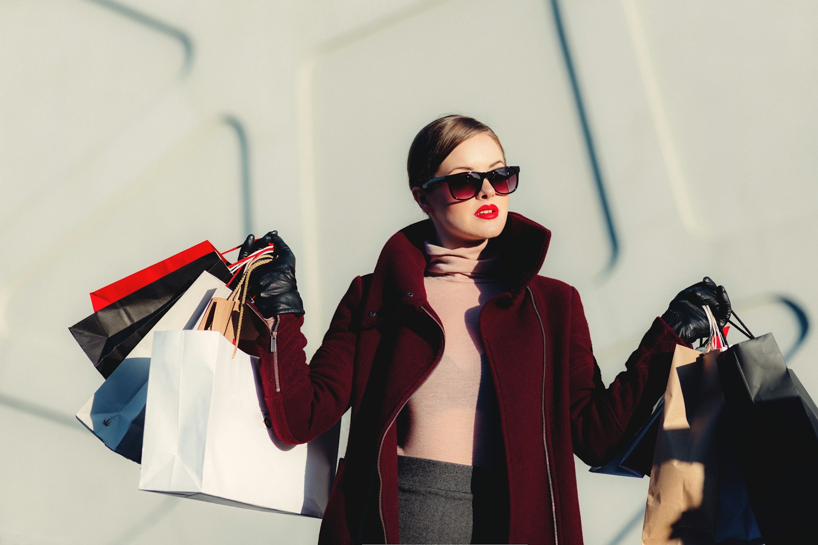 Womenswear inspiration: sunglasses and a burgundy coat